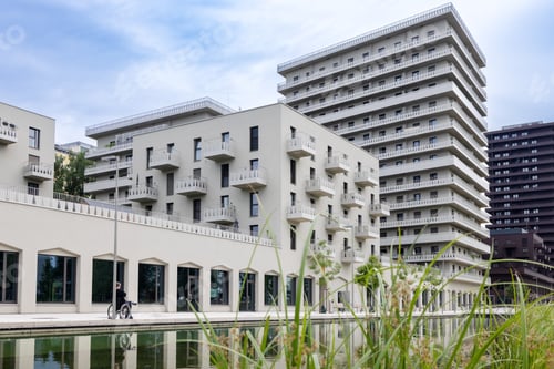 Preview: pond and modern residential bright high-rise buildings and shops in a new area of the city