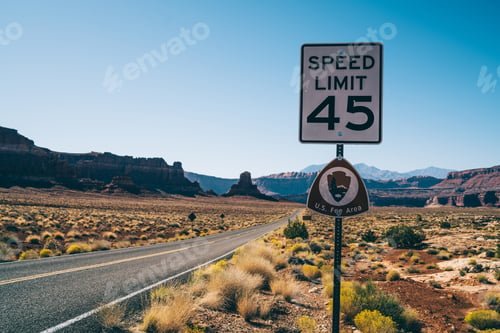 Preview: Empty road with speed limit sign on roadside
