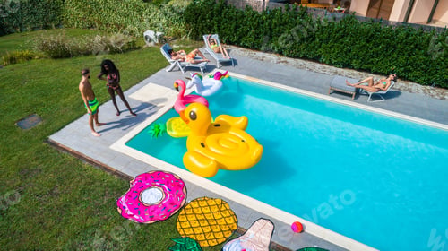 Preview: Friends having fun in a swimming pool