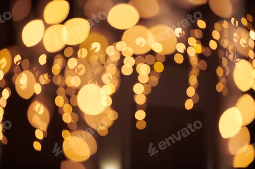 Preview: Yellow lights bokeh from christmas holiday garlands, blurred festive background, abstract lights