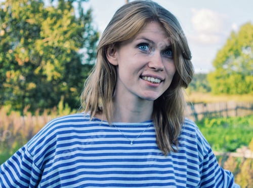 Preview: Smiling Woman in Striped Shirt Outdoors