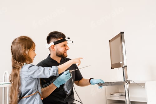 Preview: ENT doctor explains rhinoscopy and otoscopy to child patient