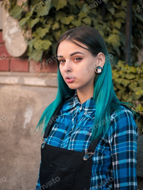 Preview: Portrait of Young girl with blue hair smoking cigarette