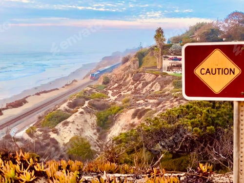 Preview: People walk along the beautiful beaches in Del Mar as the train goes by as seen from above on cliffs