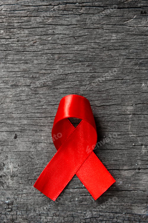Preview: Red ribbon for world aids day awareness campaign background.