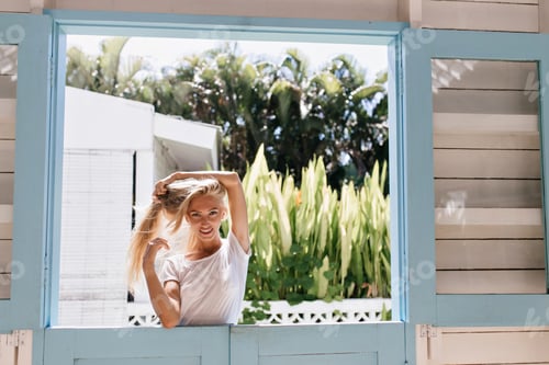 Preview: Beautiful woman spending sunny day outdoor. Photo of good-looking female model with blonde hair pos