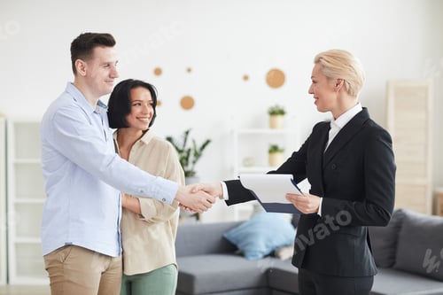Preview: Couple cooperating with realtor