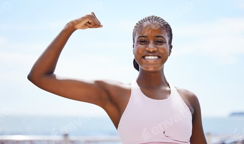 Preview: Fitness, portrait and black woman flexing muscle at the beach in summer after strength training, ex