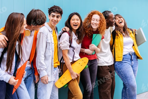 Preview: Happy multiracial teen student friends standing over isolated blue background