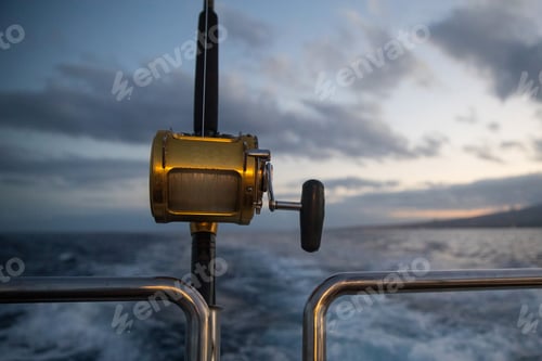 Preview: Deep Sea Fishing Reel on a boat during sunrise