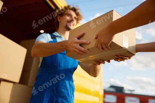 Preview: Closeup transferring of parcel cardboard box from hand to hand