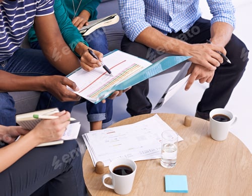Preview: The best ideas are caffeine driven. Cropped shot of a group of designers having a discussion.