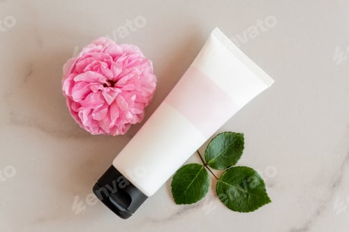 Preview: pink and white tube with rose face or body cream or scrub decorated with pink rose flowers. Skin car