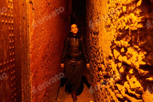 Preview: Woman on narrow street at night