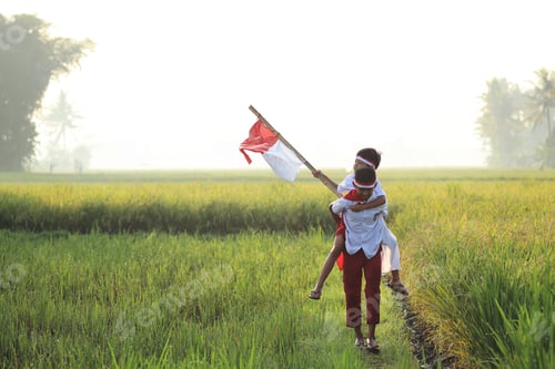 Preview: Indonesian elementary student doing piggy back and waving a flag