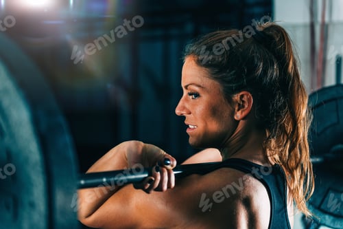 Preview: Cross training. Female athlete lifting weights