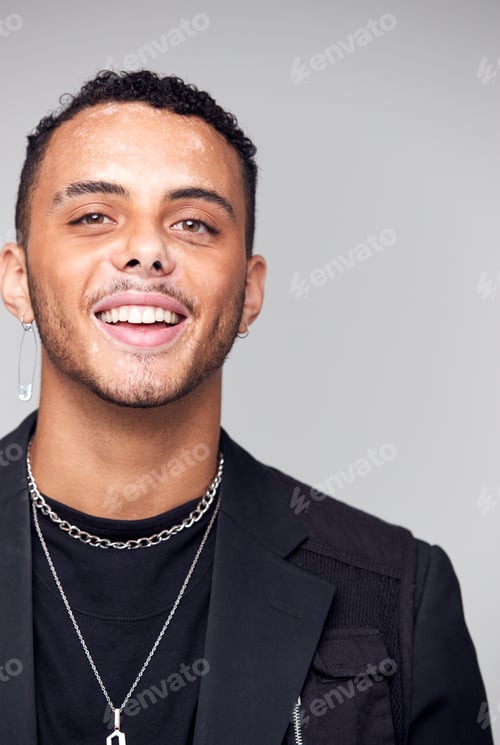 Preview: Studio Portrait Of Young Man With Skin Pigmentation Disorder Smiling At Camera