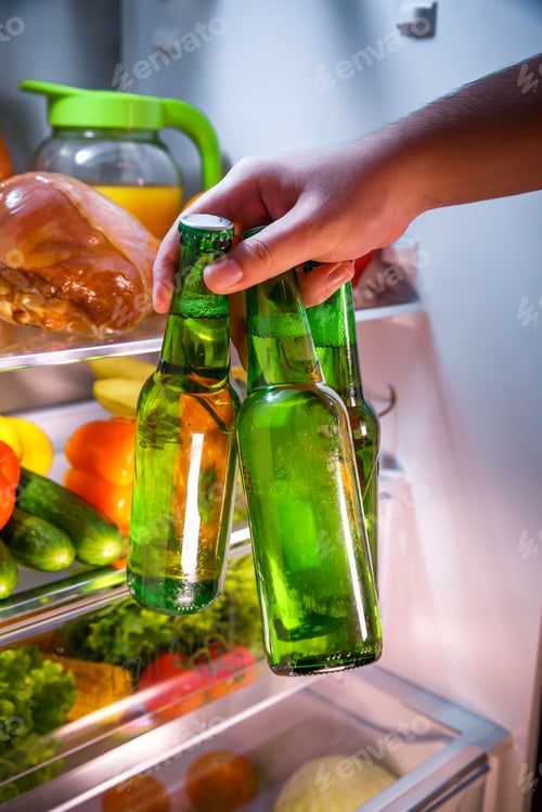 Preview: Man taking beer from a fridge