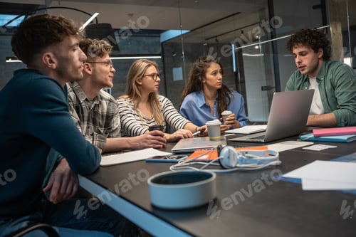 Preview: Programmers work alongside their colleagues in an office