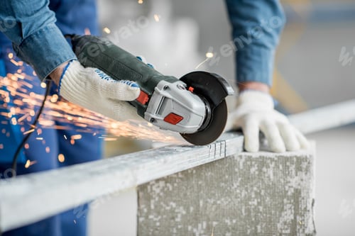 Preview: Builder cutting metal indoors