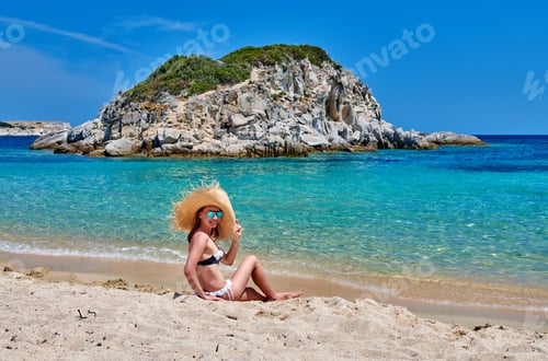 Preview: Woman In Bikini Wearing Sunglasses And Straw Sun Hat On Beach. Summer Vacation Portrait. Sithonia