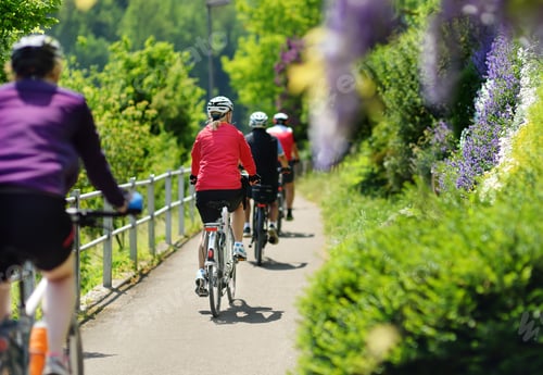 Preview: Group of Sportive man cycling in sunny park in hot summer day. Switzerland, Europe