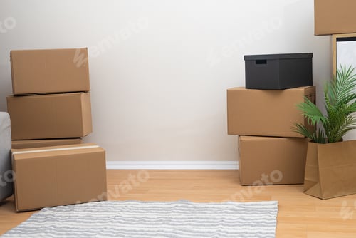 Preview: Family prepares cardboard boxes for moving in new flat