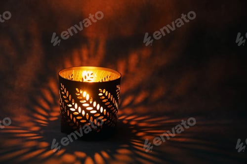 Preview: Glowing ornamental lantern with candle against dark background