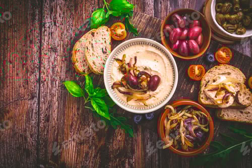 Preview: Whipped feta cheese dip with garlic, olives, lemon and caramelized onions.