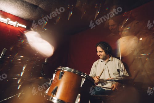 Preview: Musician playing drums in recording studio with motion blur effect