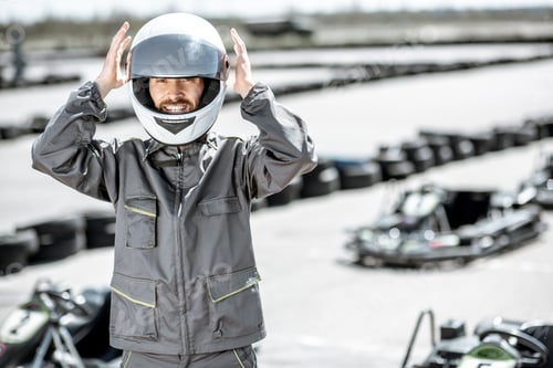 Preview: Man in Racing Suit Wearing Racing Helmet