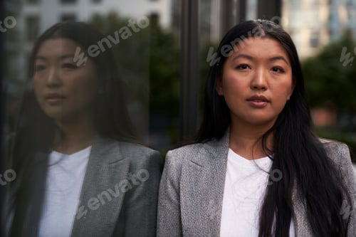 Preview: Close up portrait of business Chinese woman standing on the street