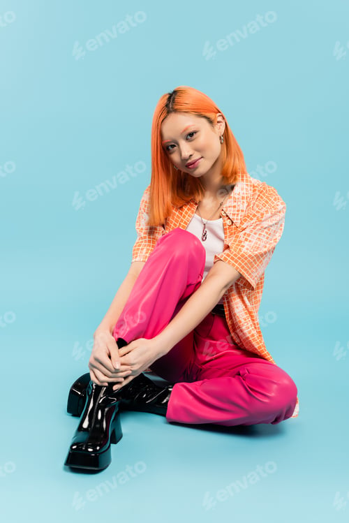 Preview: vibrant and happy personality, full length of young and trendy asian woman sitting and smiling