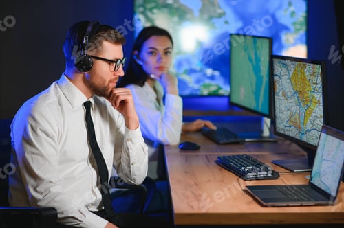 Preview: Center of dispatching maintenance. Portrait of cheerful woman and man working via headset microphone
