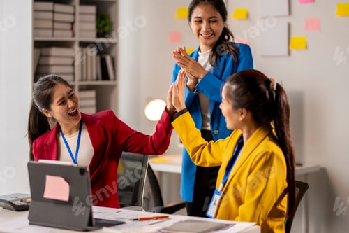 Preview: Three women are standing in a room and clapping each other