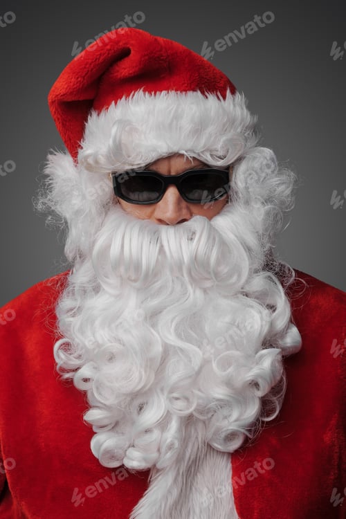 Preview: Bearded santa hipster with sunglasses staring at camera
