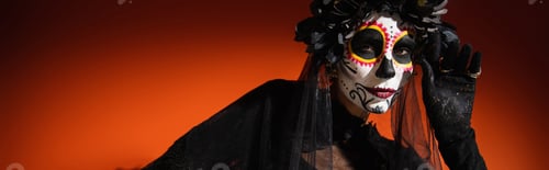 Preview: Woman in halloween day of death costume posing and looking at camera on red background, banner