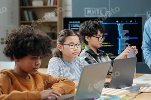 Preview: Group of Children Studying Together in Classroom