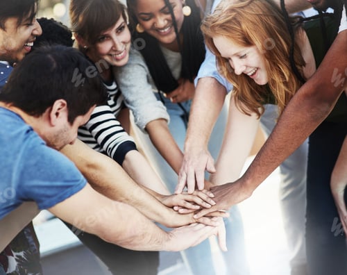 Preview: As a team. Cropped shot of unrecognizable businesspeople coming together as a team.