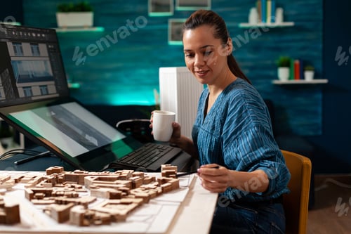 Preview: Woman with architect occupation working on blueprint