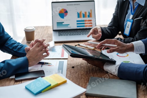 Preview: Business team analyzing income charts and graphs with modern laptop computer. Close up.Business anal