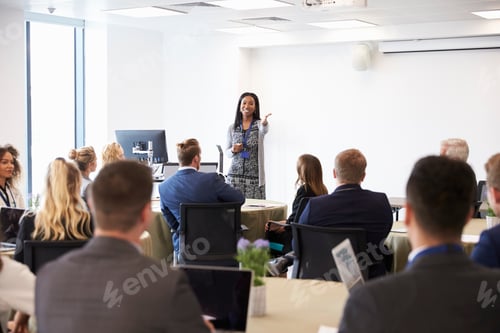 Preview: Businesswoman Making Presentation At Conference