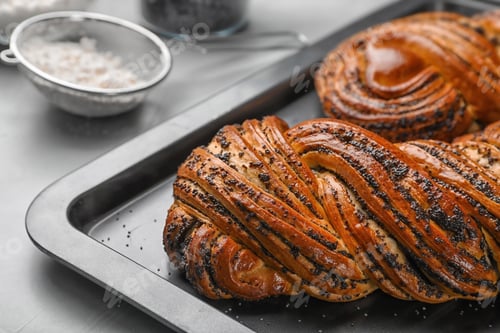 Preview: Tasty sweet buns with poppy seeds on gray table