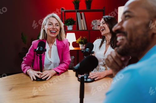 Preview: Content creators broadcasting live podcast interview using microphones