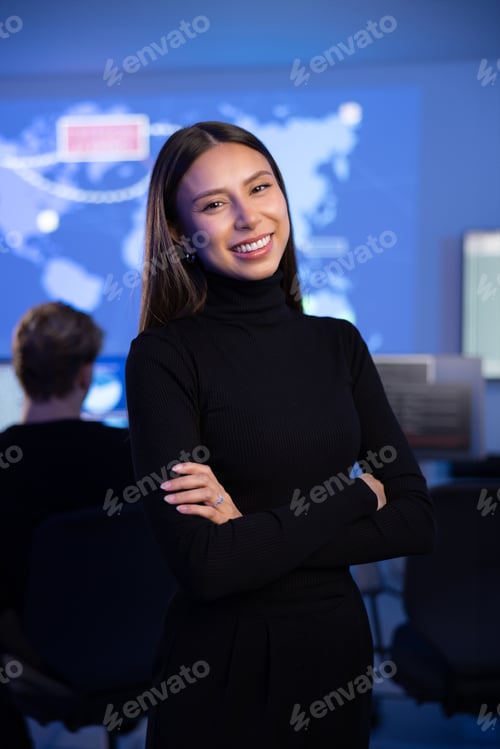 Preview: Smiling Confident Female Cybersecurity Analyst or Manager in large Cyber Security Operations Center