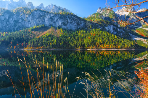 Preview: autumn scenery with Dachstein mountain summit reflecting in crystal clear Gosausee mountain lake
