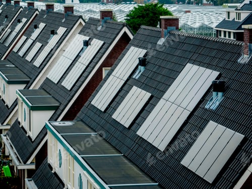 Preview: Solar panels on roofs of new homes under construction.