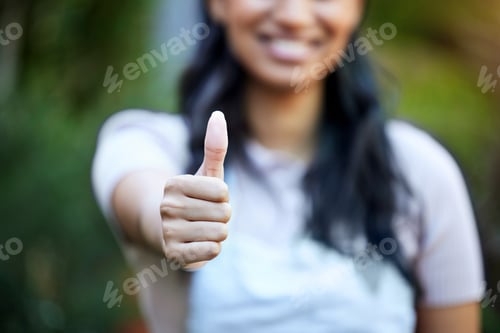 Preview: Planet provided. Shot of a female business owner giving the thumbs up in her nursery.