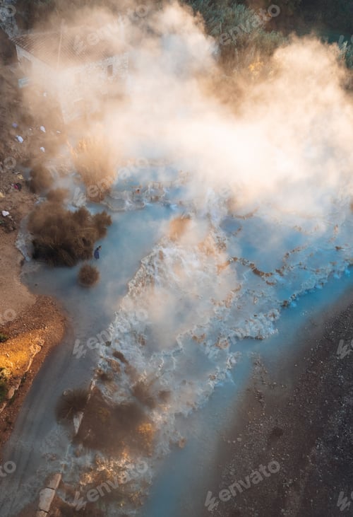 Preview: aerial view of the Val d'Orcia region in Tuscany, Italy, featuring the blue water and white fog