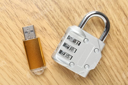 Preview: Flash drive and combination padlock on wooden background, flat lay